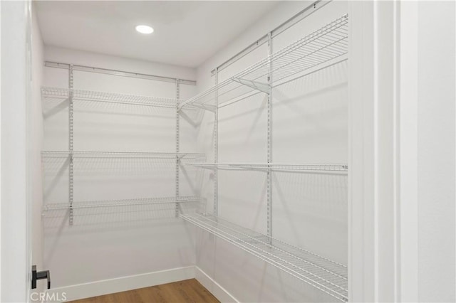 58424 Canterbury St, Yucca Valley, CA 92284 - walk in closet featuring wood finished floors