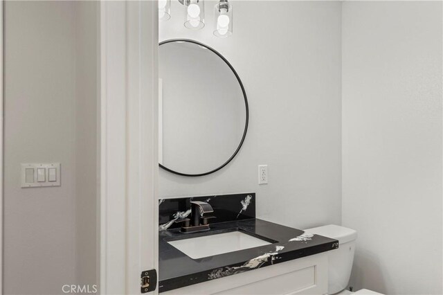 58424 Canterbury St, Yucca Valley, CA 92284 - half bathroom featuring vanity and toilet