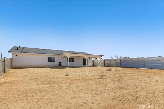 58424 Canterbury St, Yucca Valley, CA 92284 - back of property featuring a patio, a fenced backyard, and stucco siding