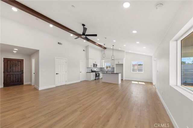 58424 Canterbury St, Yucca Valley, CA 92284 - unfurnished living room featuring recessed lighting, a ceiling fan, high vaulted ceiling, light wood finished floors, and beam ceiling