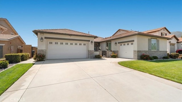5120 Armendarez Ln, Fontana, CA 92336 - ranch-style home with stucco siding, a garage, concrete driveway, a front lawn, and brick siding