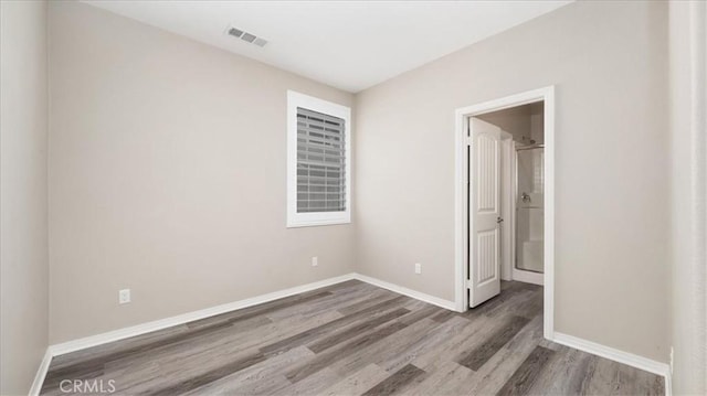5120 Armendarez Ln, Fontana, CA 92336 - spare room featuring wood finished floors and baseboards