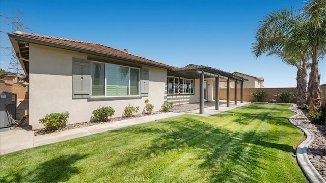 5120 Armendarez Ln, Fontana, CA 92336 - rear view of house with a pergola, stucco siding, a fenced backyard, and a patio area