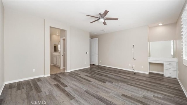 5120 Armendarez Ln, Fontana, CA 92336 - unfurnished living room with wood finished floors, built in study area, and ceiling fan