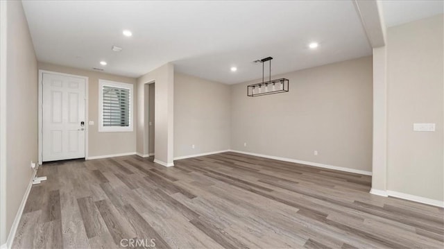 5120 Armendarez Ln, Fontana, CA 92336 - unfurnished room featuring wood finished floors and recessed lighting