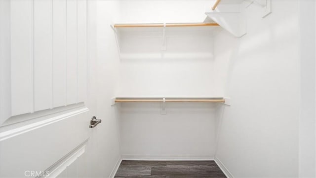5120 Armendarez Ln, Fontana, CA 92336 - walk in closet with dark wood-style floors