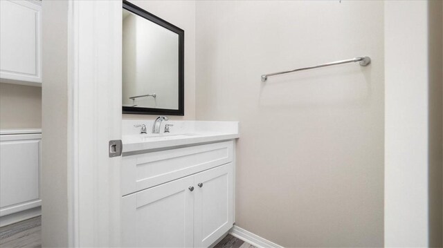 5120 Armendarez Ln, Fontana, CA 92336 - bathroom featuring vanity and wood finished floors