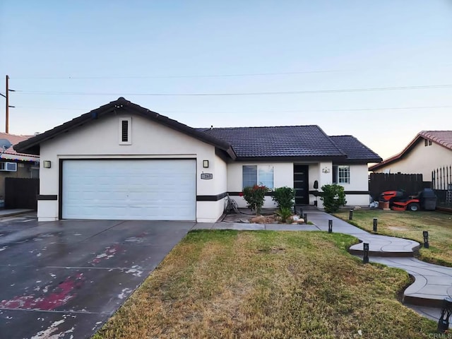 1268 J B Rodriguez St, Calexico, CA 92231 - ranch-style home with stucco siding, a garage, concrete driveway, and a tile roof