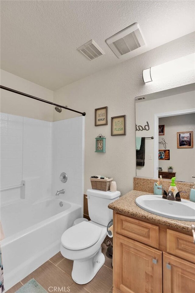 26460 Gem Ct, Helendale, CA 92342 - full bath featuring shower / tub combination, vanity, and a textured ceiling