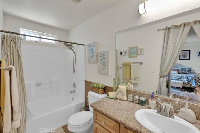 26460 Gem Ct, Helendale, CA 92342 - full bathroom with vanity, shower / bath combo, and ensuite bathroom