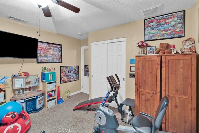 26460 Gem Ct, Helendale, CA 92342 - workout room featuring a textured ceiling, carpet, and ceiling fan