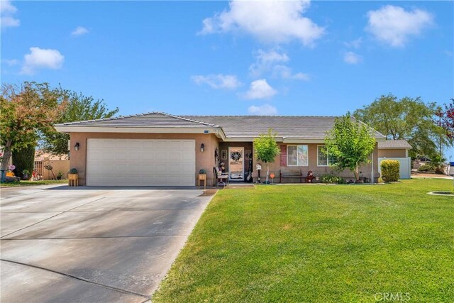 26460 Gem Ct, Helendale, CA 92342 - single story home featuring stucco siding, concrete driveway, a garage, a front yard, and a tile roof