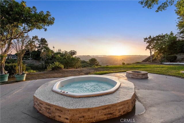 24135 Las Naranjas Dr, Laguna Niguel, CA 92677 - pool at dusk featuring an outdoor fire pit and an in-ground hot tub