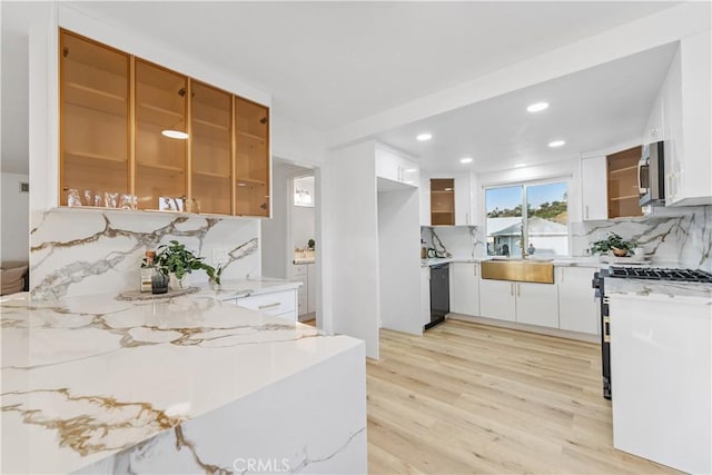 24135 Las Naranjas Dr, Laguna Niguel, CA 92677 - kitchen featuring appliances with stainless steel finishes, backsplash, light wood-style flooring, recessed lighting, and white cabinets