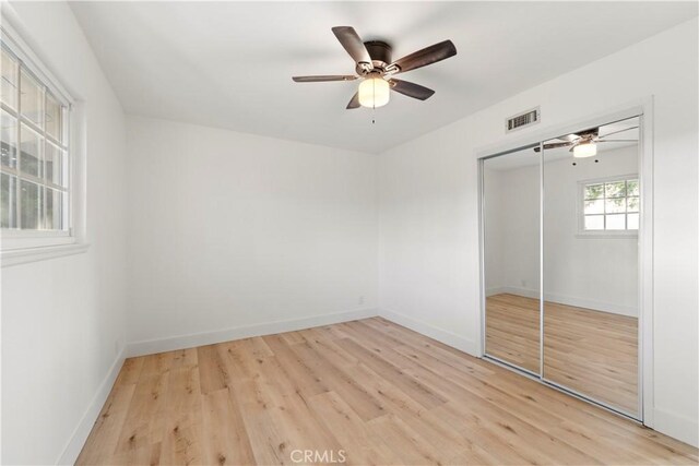24135 Las Naranjas Dr, Laguna Niguel, CA 92677 - unfurnished bedroom with light wood-type flooring, a closet, and a ceiling fan