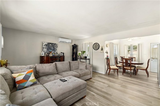 1022 E Lancaster Blvd, Lancaster, CA 93535 - living room with a wall mounted AC and light wood-type flooring