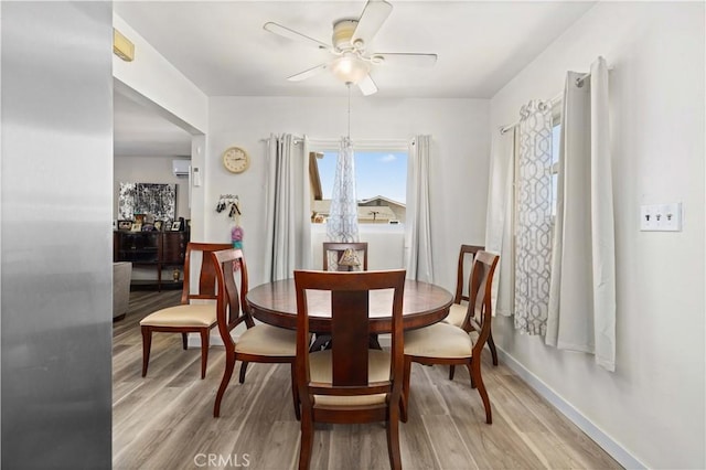 1022 E Lancaster Blvd, Lancaster, CA 93535 - dining room with ceiling fan, light wood-style flooring, and a wall mounted AC