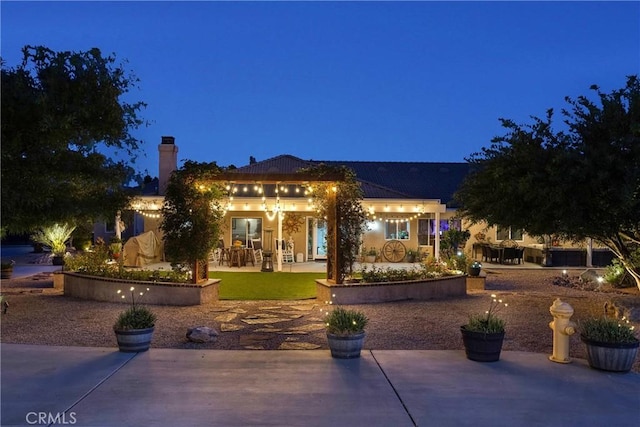 19420 Red Feather Rd, Apple Valley, CA 92307 - patio at twilight with a patio