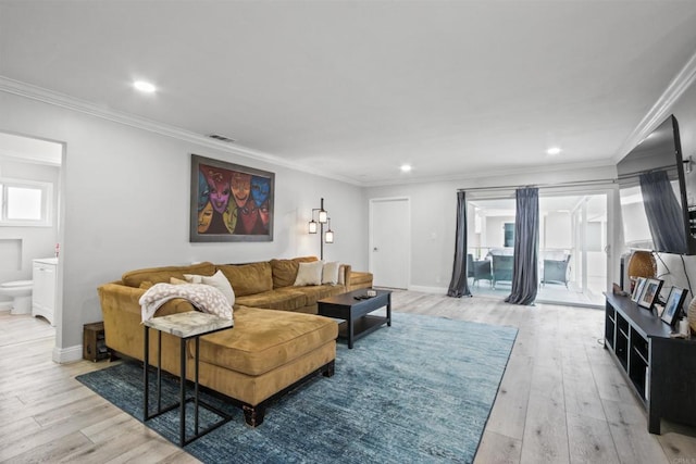 4903 Deeboyar Ave, Lakewood, CA 90712 - living room featuring light wood-type flooring, ornamental molding, and recessed lighting