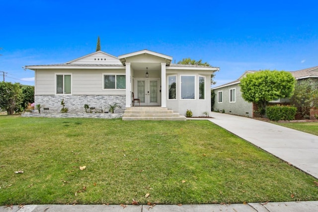 4903 Deeboyar Ave, Lakewood, CA 90712 - view of front of property with french doors, a front yard, and stone siding