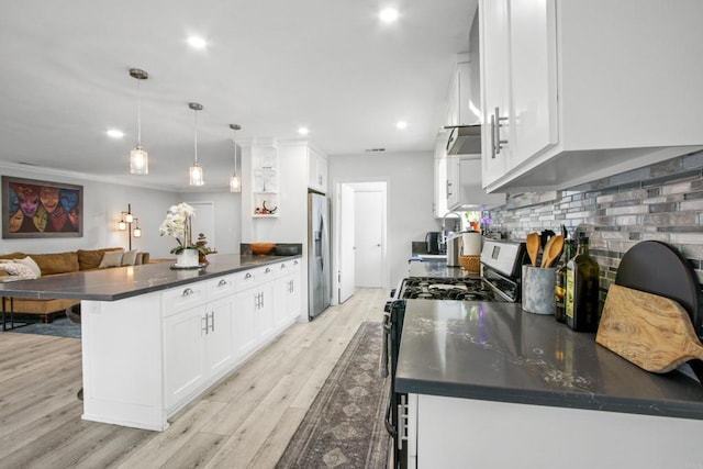 4903 Deeboyar Ave, Lakewood, CA 90712 - kitchen featuring appliances with stainless steel finishes, a peninsula, dark countertops, light wood-style flooring, and white cabinets