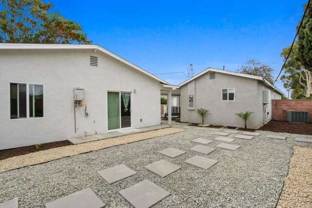4903 Deeboyar Ave, Lakewood, CA 90712 - rear view of house with stucco siding and a patio