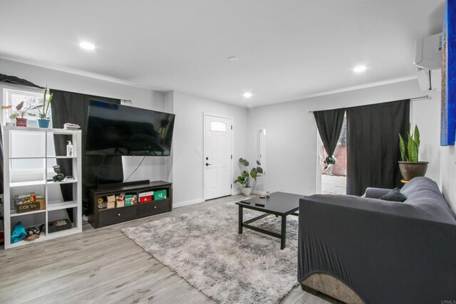 4903 Deeboyar Ave, Lakewood, CA 90712 - living area with wood finished floors, recessed lighting, and a wall unit AC