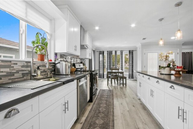 4903 Deeboyar Ave, Lakewood, CA 90712 - kitchen with dark countertops, dishwasher, range, tasteful backsplash, and recessed lighting