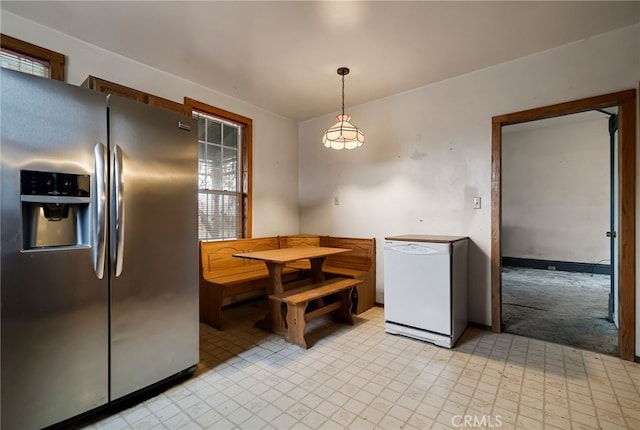 707 Marin St, Corning, CA 96021 - kitchen with stainless steel refrigerator with ice dispenser, refrigerator, and hanging light fixtures