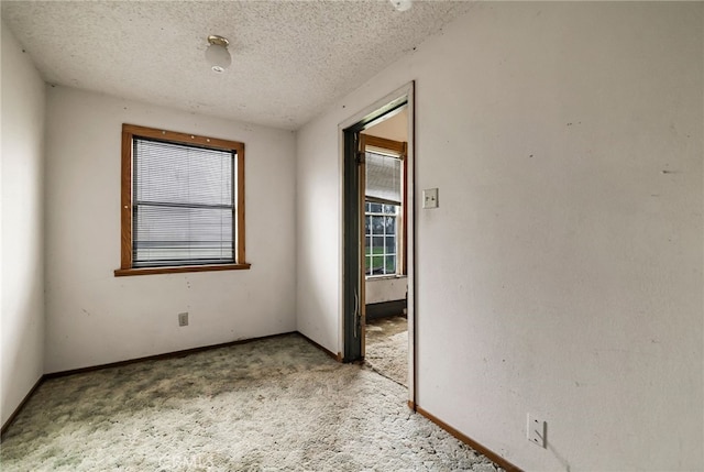 707 Marin St, Corning, CA 96021 - carpeted spare room with a textured ceiling and baseboards
