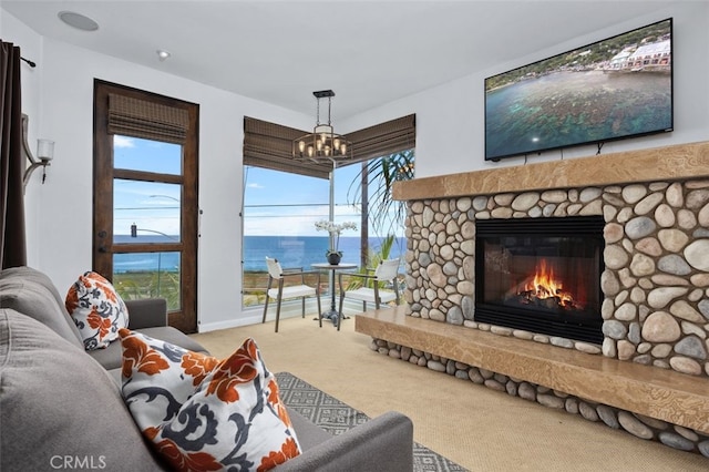 5390 Carlsbad Blvd, Carlsbad, CA 92008 - living area with a chandelier, carpet floors, and a fireplace
