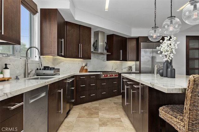 5390 Carlsbad Blvd, Carlsbad, CA 92008 - kitchen with appliances with stainless steel finishes, backsplash, decorative light fixtures, and light stone countertops