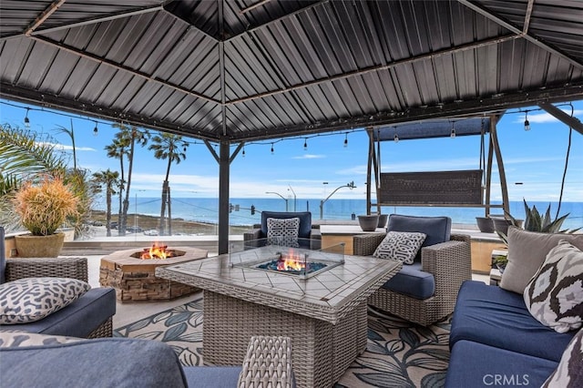 5390 Carlsbad Blvd, Carlsbad, CA 92008 - view of patio featuring a water view, a gazebo, and an outdoor living space with a fire pit