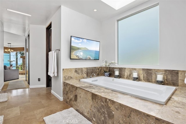5390 Carlsbad Blvd, Carlsbad, CA 92008 - full bathroom with a garden tub and a chandelier