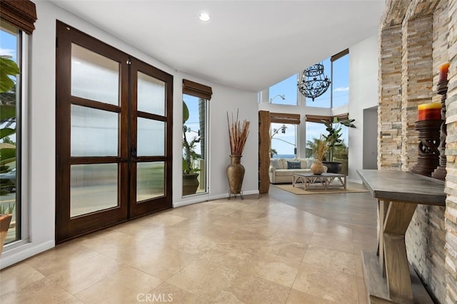 5390 Carlsbad Blvd, Carlsbad, CA 92008 - unfurnished sunroom with french doors and a chandelier