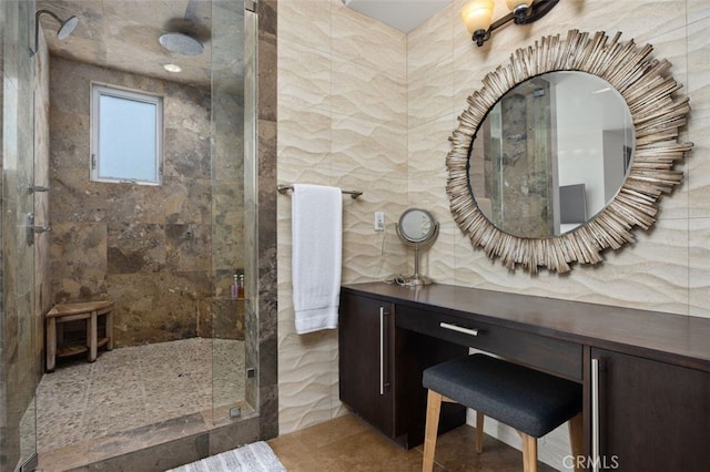 5390 Carlsbad Blvd, Carlsbad, CA 92008 - bathroom with a shower stall, tile walls, and vanity