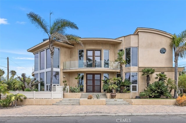 5390 Carlsbad Blvd, Carlsbad, CA 92008 - view of front facade featuring french doors and stucco siding