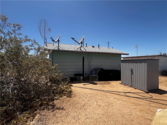 1489 Balsa Ave, Yucca Valley, CA 92284 - back of house with a storage unit