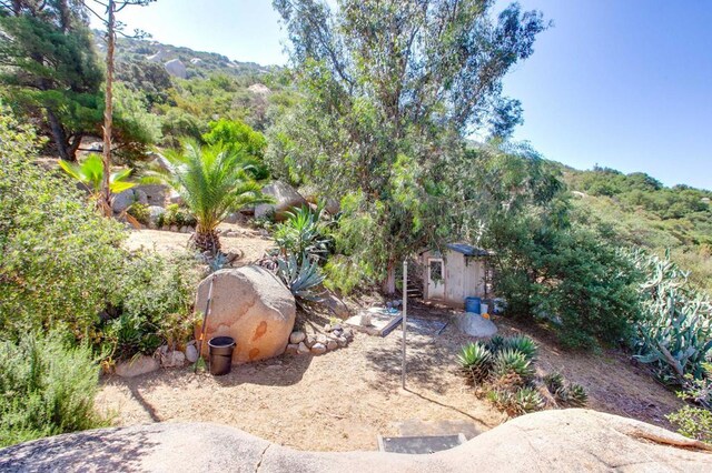 46920 Rainbow Canyon Rd, Temecula, CA 92592 - view of yard featuring a storage unit