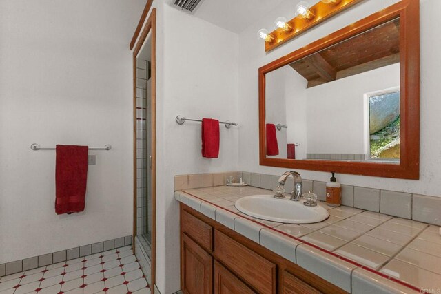46920 Rainbow Canyon Rd, Temecula, CA 92592 - bathroom with vanity, tile patterned floors, a shower, and beamed ceiling