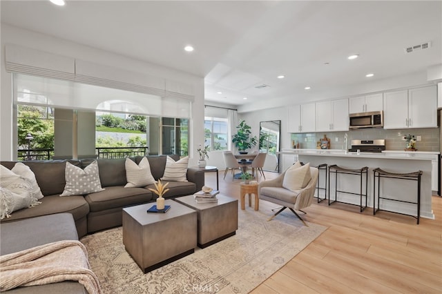 305 Blackrock, Lake Forest, CA 92610 - living area with light wood-type flooring and recessed lighting
