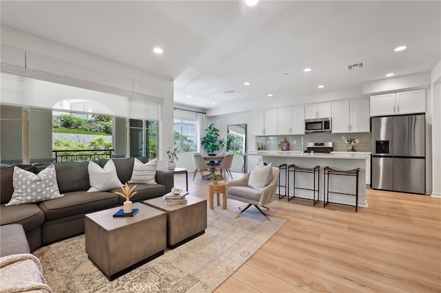 305 Blackrock, Lake Forest, CA 92610 - living area with recessed lighting and light wood-style floors