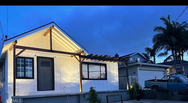883 W Crestwood St, San Pedro, CA 90731 - view of front of house with board and batten siding and an attached garage