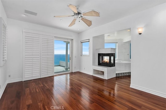 2016 Calle De Los Alamos, San Clemente, CA 92672 - unfurnished living room featuring wood-type flooring, a multi sided fireplace, and ceiling fan