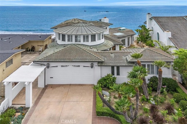 2016 Calle De Los Alamos, San Clemente, CA 92672 - view of front of property with an attached garage, concrete driveway, stucco siding, and a water view