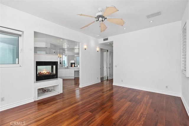 2016 Calle De Los Alamos, San Clemente, CA 92672 - unfurnished living room featuring wood finished floors, a ceiling fan, and a multi sided fireplace