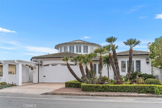 2016 Calle De Los Alamos, San Clemente, CA 92672 - mediterranean / spanish home with concrete driveway, an attached garage, stucco siding, and a chimney