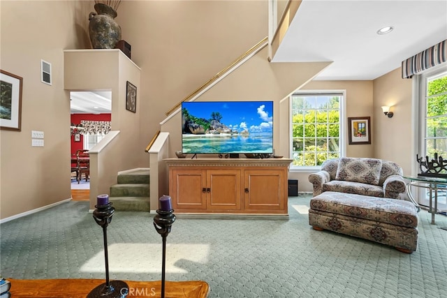 8601 Rudnick Ave, West Hills, CA 91304 - living area with carpet flooring, stairway, and recessed lighting