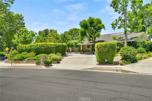 8601 Rudnick Ave, West Hills, CA 91304 - view of front of house featuring concrete driveway
