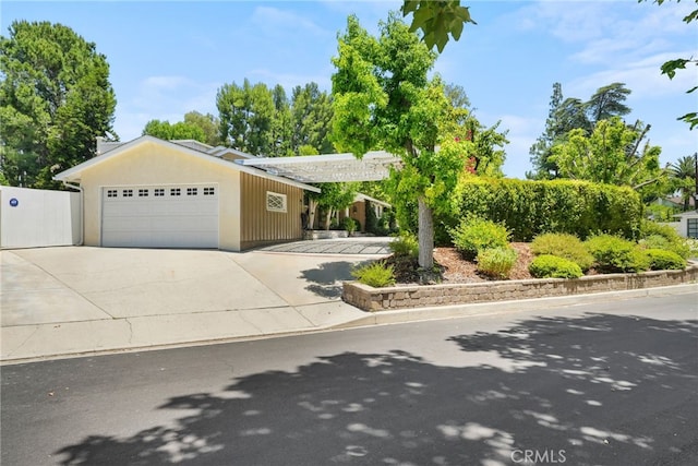 8601 Rudnick Ave, West Hills, CA 91304 - view of front of home with an attached garage and concrete driveway